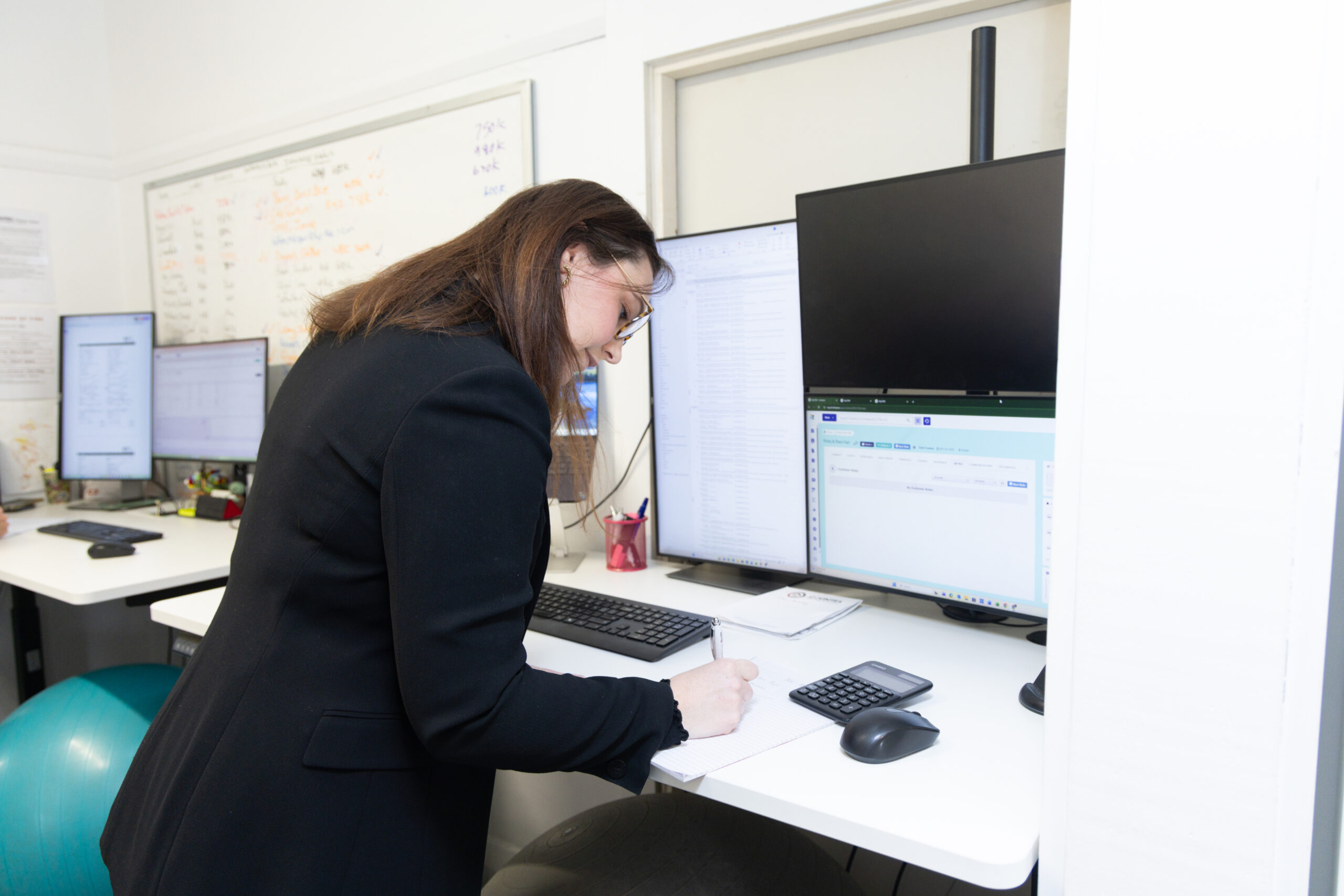 Woman talking on the phone in an office