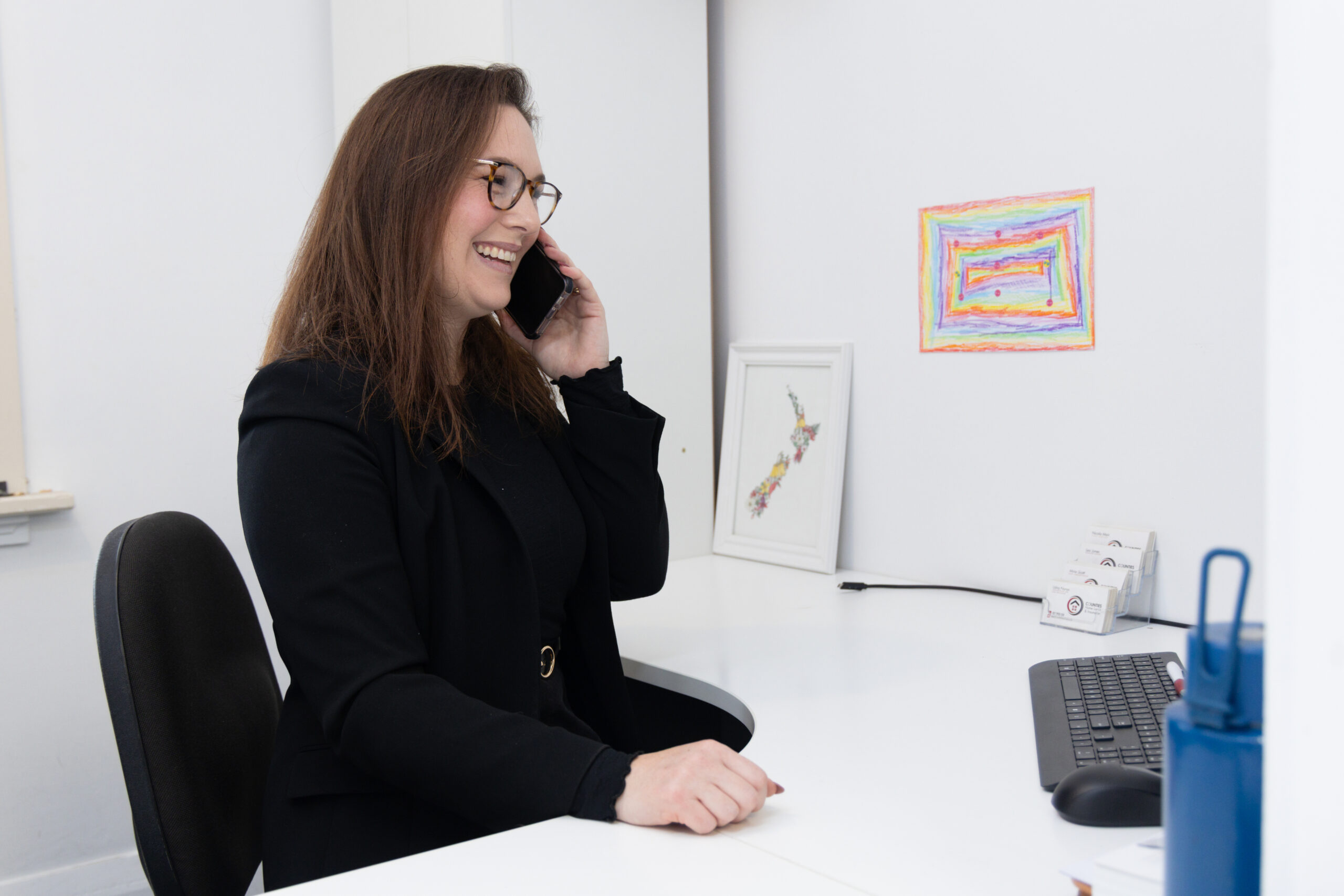 Woman talking on the phone in an office